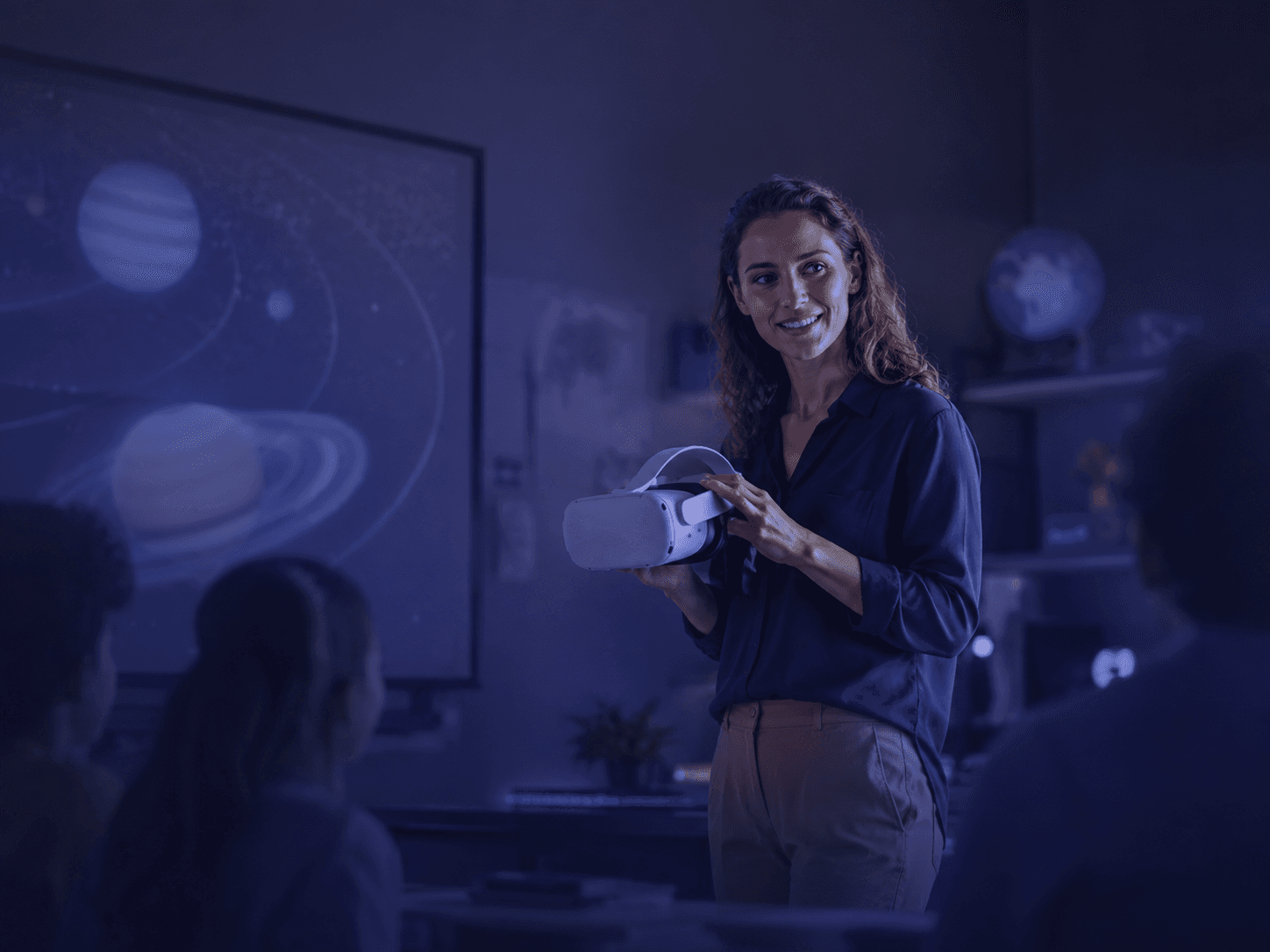Teacher introducing an immersive VR learning experience in a classroom