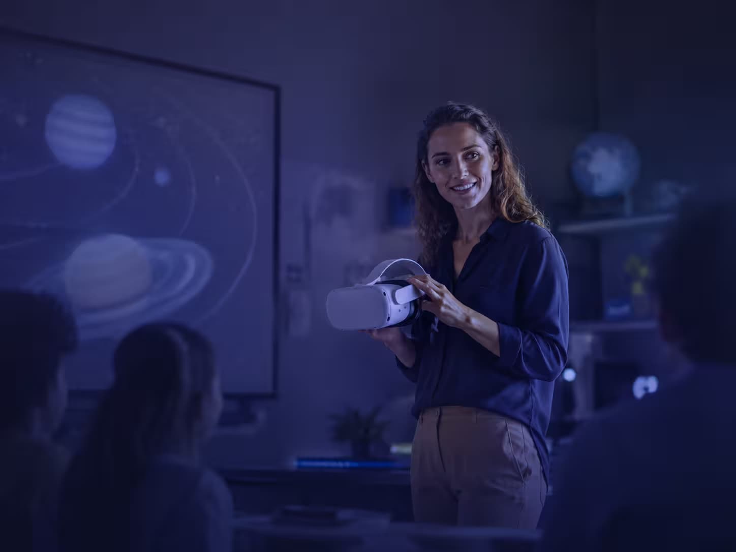 Teacher introducing a VR headset during an immersive classroom lesson